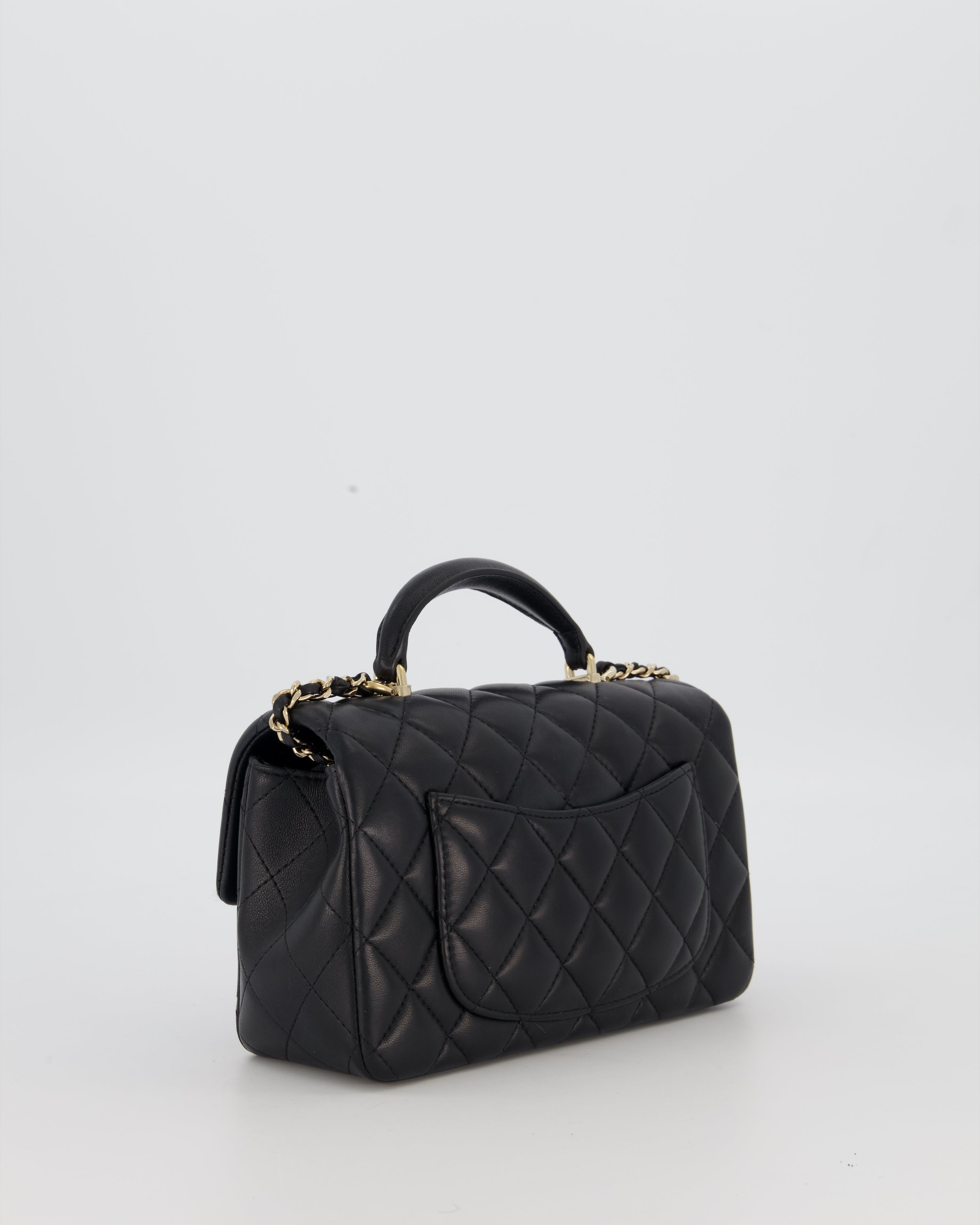 Chanel Black Mini Rectangular Top Handle Flap Bag in Lambskin Leather with Champagne Hardware and Strass Removable Bow Charm