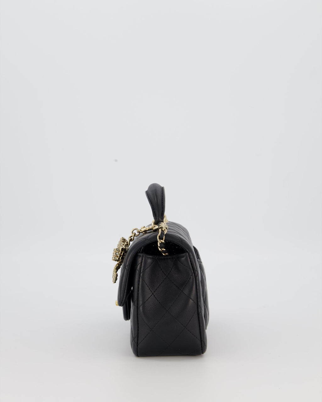 Chanel Black Mini Rectangular Top Handle Flap Bag in Lambskin Leather with Champagne Hardware and Strass Removable Bow Charm