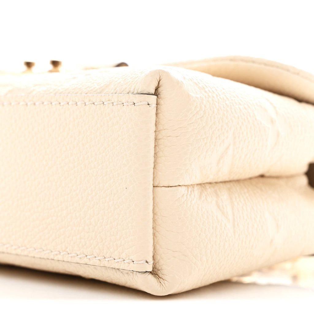 Louis Vuitton Empreinte Monogram Nano Madeleine Creme