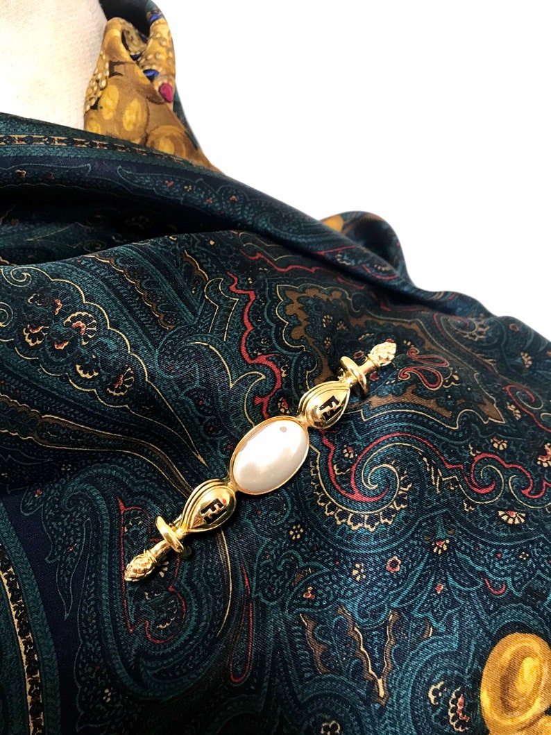 FENDI Vintage gold tone hat pin with white oval faux pearl and FF mark