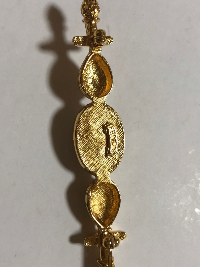 FENDI Vintage gold tone hat pin with white oval faux pearl and FF mark