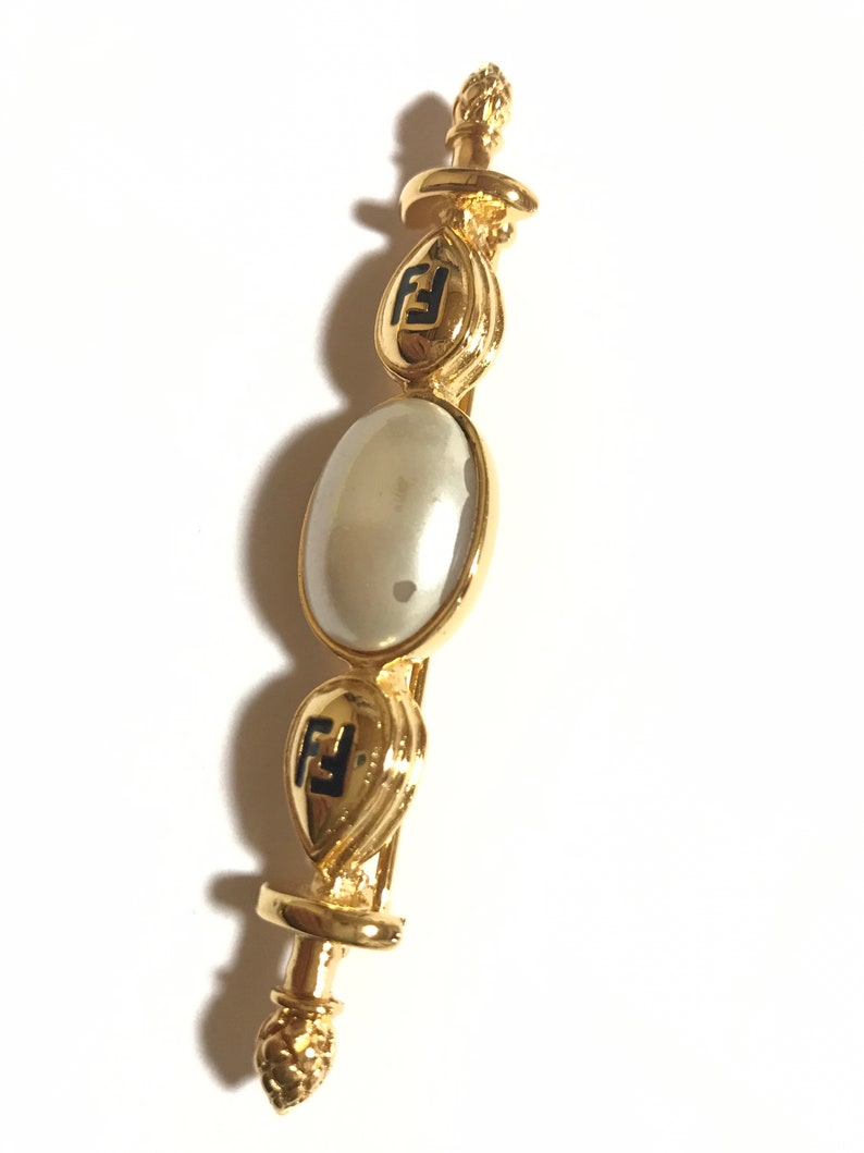 FENDI Vintage gold tone hat pin with white oval faux pearl and FF mark