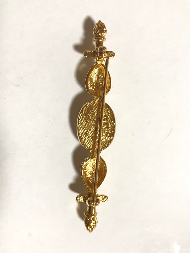 FENDI Vintage gold tone hat pin with white oval faux pearl and FF mark