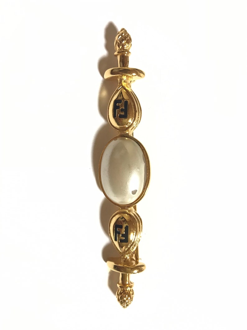FENDI Vintage gold tone hat pin with white oval faux pearl and FF mark