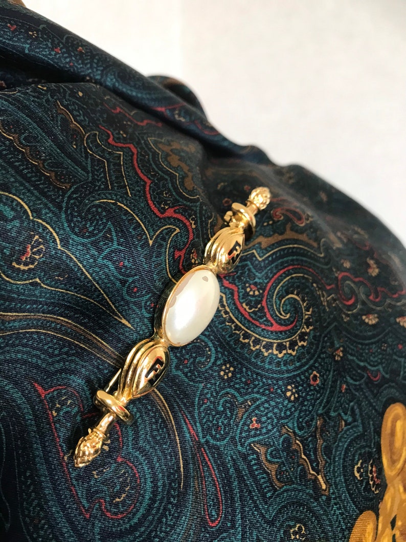 FENDI Vintage gold tone hat pin with white oval faux pearl and FF mark